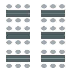 Figure of classroom arrangement with chairs on either side of individual tables.