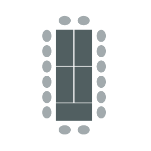 Figure of boardroom arrangement with several tables arranged in large rectangle with chairs around outside edge.