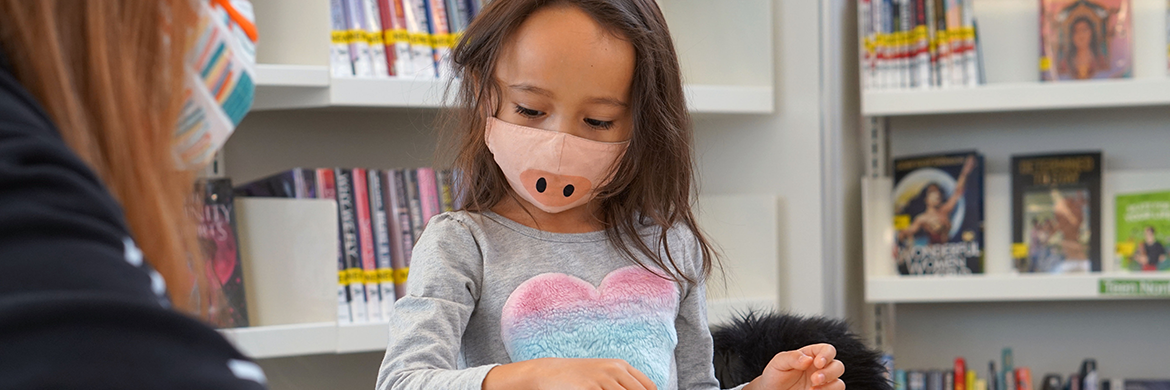 Young girl playing with a game at Lincolnwood Library