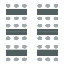 Figure of classroom arrangement with chairs on either side of individual tables.